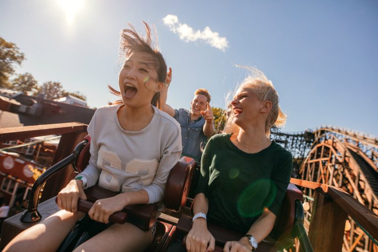 kids riding a roller coaster