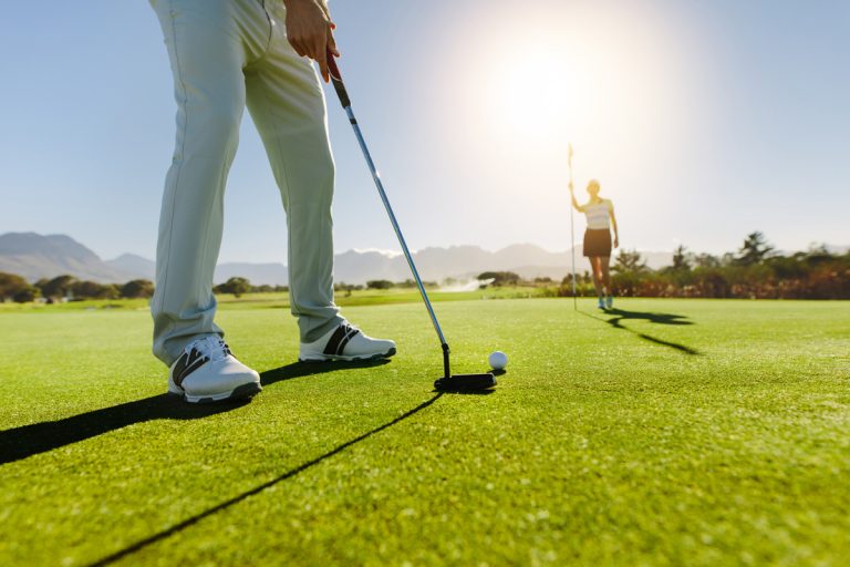 teeing off during golf